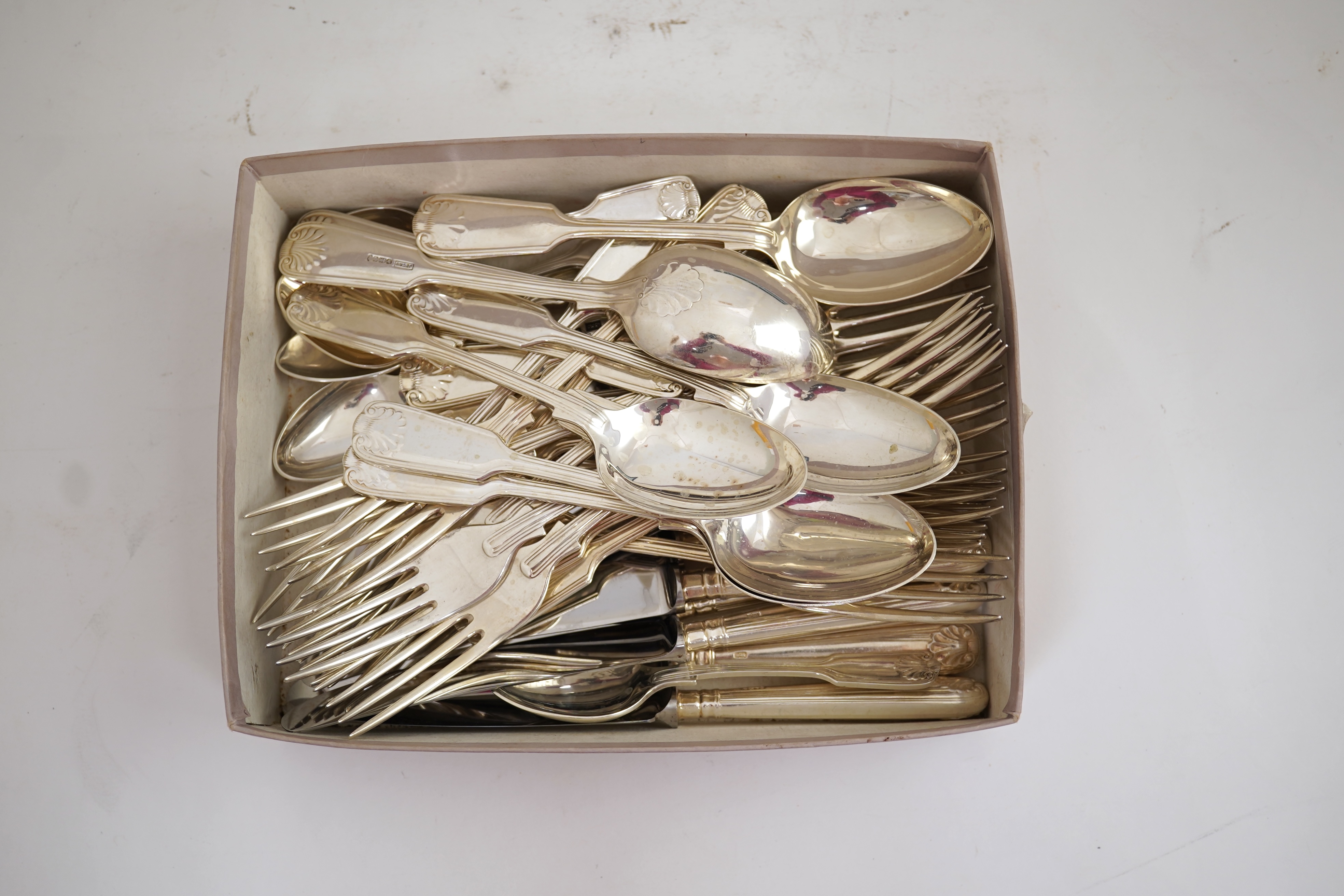 An Elizabeth II part canteen of silver fiddle, thread and shell pattern cutlery, by J B Chatterley & Sons Ltd